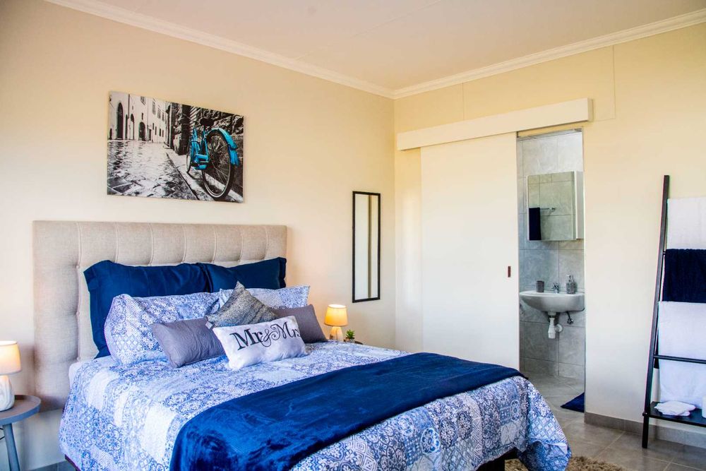 Main bedroom with built-in cupboards & ensuite.