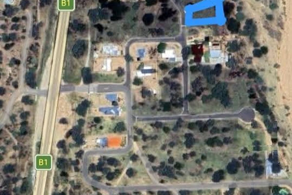 Aerial view of a residential plot in Okahandja Extension 16, showing the surrounding road network and natural landscape.