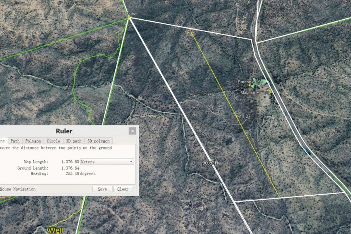 An aerial satellite view of a 90.03-hectare residential land parcel showing property boundaries, terrain, and existing borehole infrastructure.