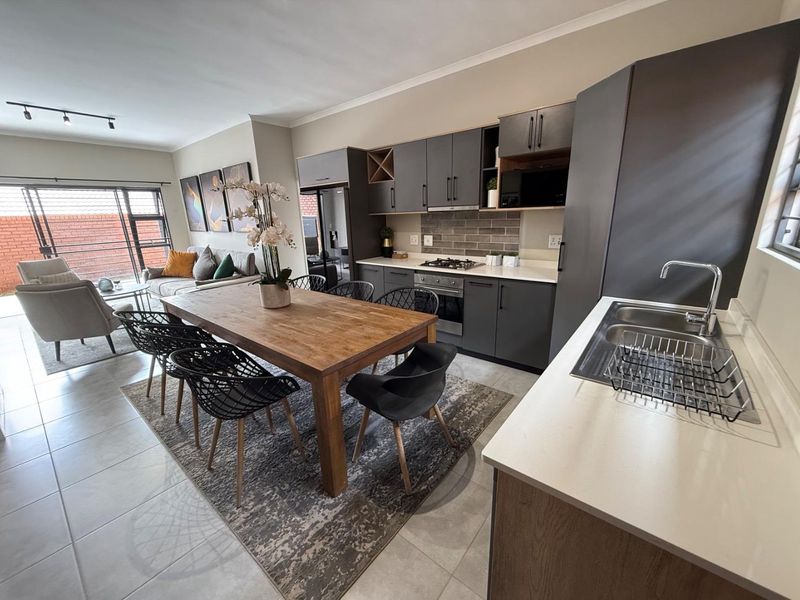 Sophisticated 3-Bedroom Simplex with Double Garage and Private Garden Sanctuary - Photo 3