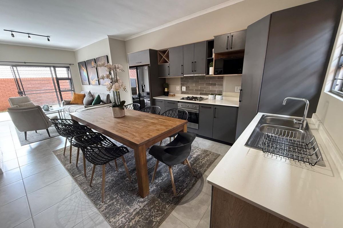 Sophisticated 3-Bedroom Simplex with Double Garage and Private Garden Sanctuary - Photo 3