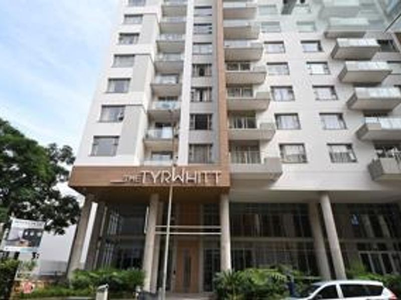 Front elevation of The Tyrwhitt penthouse building, showcasing modern architectural design with multiple balconies and glass balustrades.