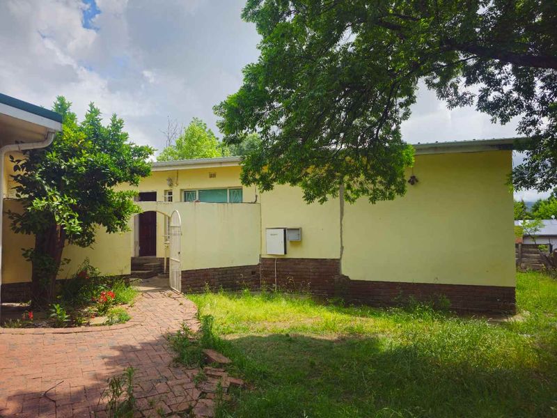 **Spacious 4-Bedroom Property with Immense Potential** - Photo 2