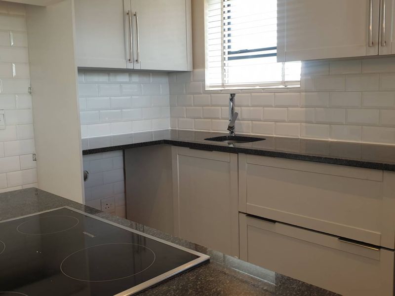 Swing Into Style: Sunlit 1st Floor Haven with Designer Kitchen in Golf Estate - Photo 6