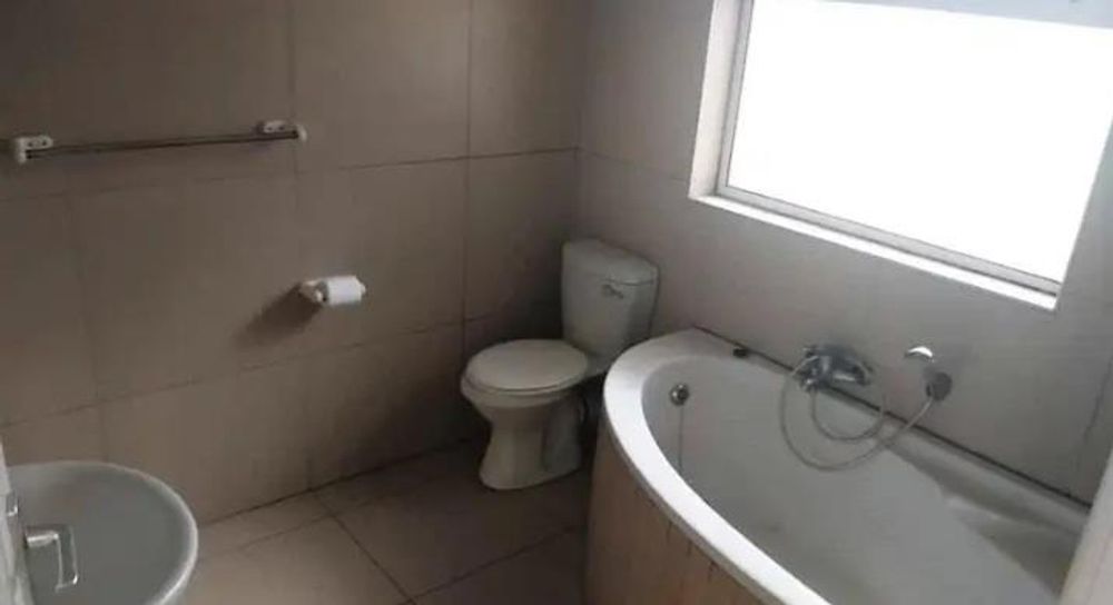 Bathroom with corner bath