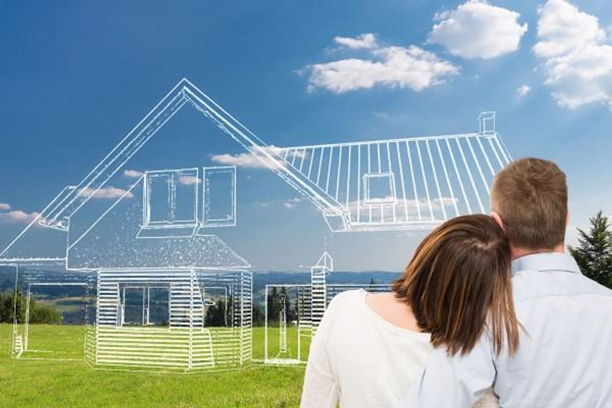 A conceptual image showing a digital sketch of a house superimposed over a vacant residential plot.