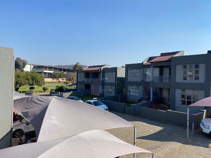 Neat 2-Bedroom Townhouse with Enclosed Balcony in Secure Complex - Photo 1