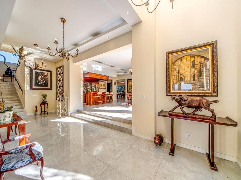 Indulge in the ultimate entertainment experience with a spacious bar and rooftop area - Photo 2