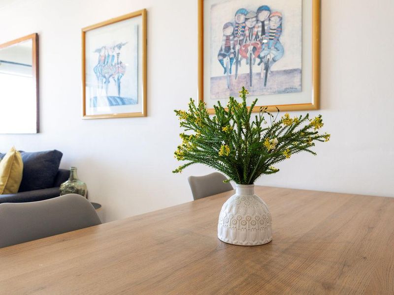 A bright and well-maintained living area featuring neutral walls and clean finishes, providing a comfortable and inviting space.