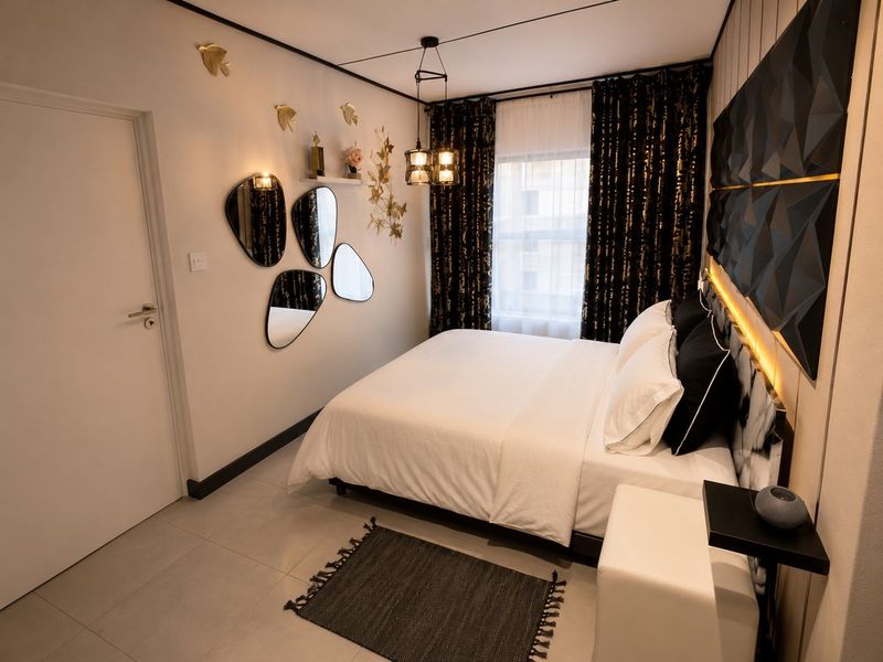 A modern, well-appointed bedroom featuring tiled flooring, decorative wall paneling with integrated lighting, and contemporary pendant fixtures.