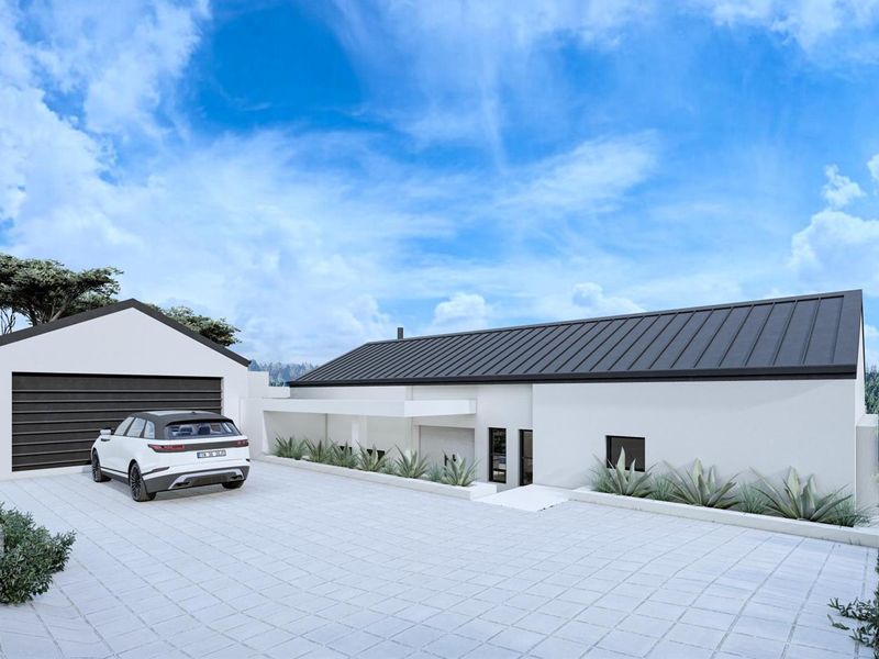Modern single-story residence featuring a clean white facade, dark metal roof, paved driveway, and an integrated garage.