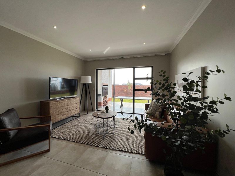 Unique iQ Marula 3-Bedroom Single-Level Townhouse with stacking doors by the patio and Double Garage - Photo 6