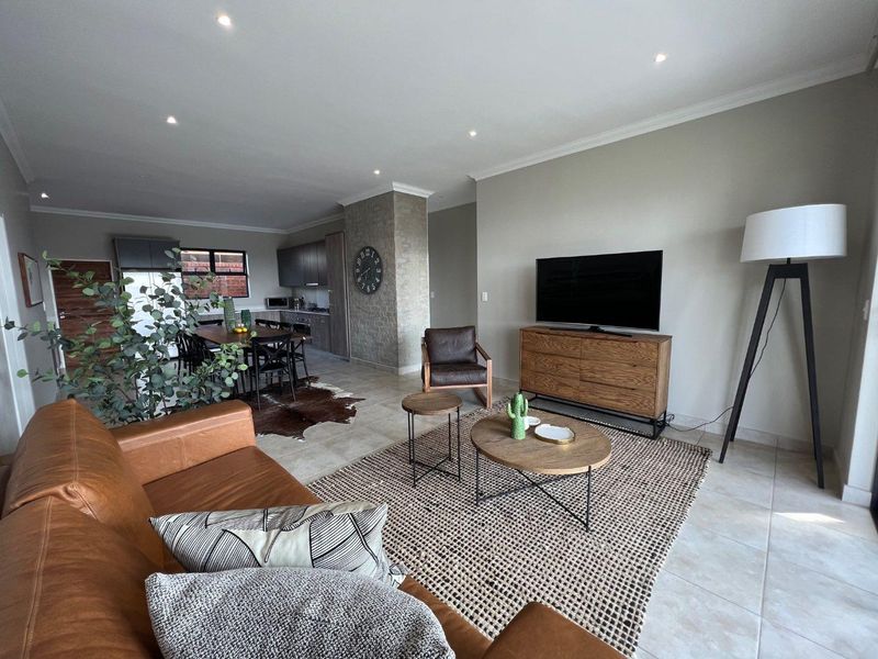 Unique iQ Marula 3-Bedroom Single-Level Townhouse with stacking doors by the patio and Double Garage - Photo 5