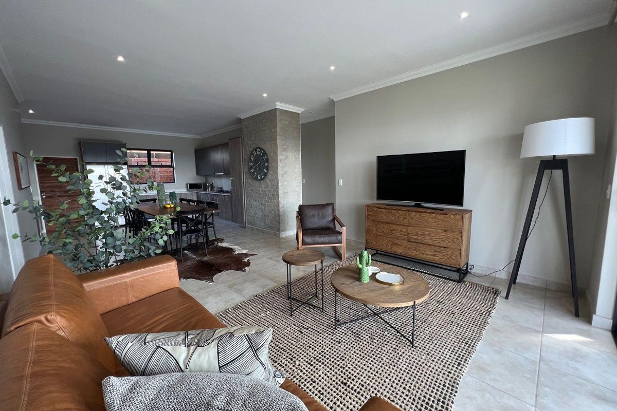 Unique iQ Marula 3-Bedroom Single-Level Townhouse with stacking doors by the patio and Double Garage - Photo 5