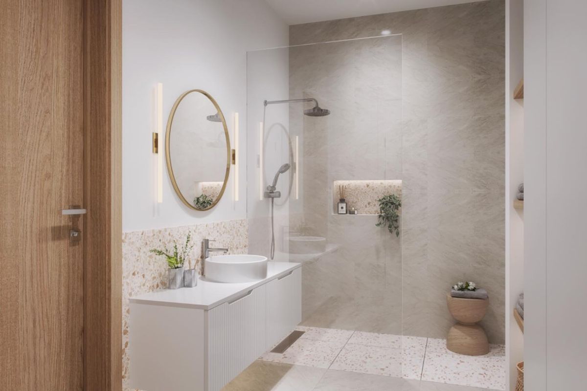 Modern bathroom featuring a floating vanity, vessel sink, walk-in shower with glass screen, and elegant terrazzo-style tile accents.