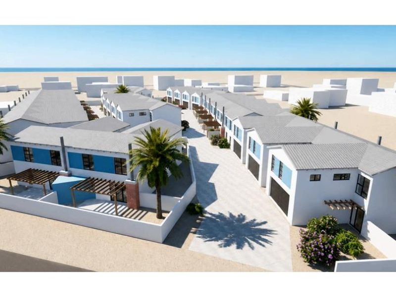 An aerial perspective of a modern townhouse development featuring uniform pitched roofs, paved driveways, and private outdoor pergola areas.