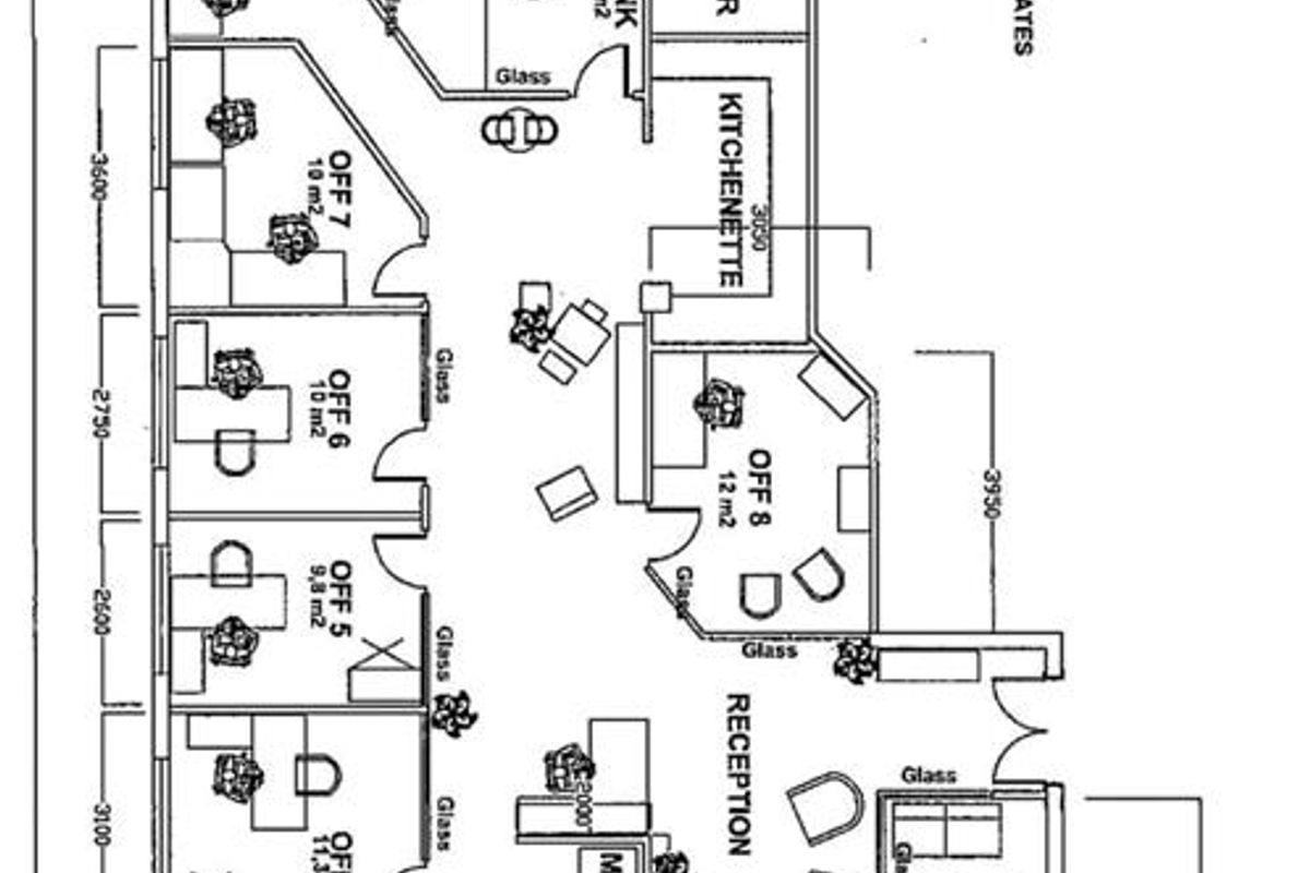 A detailed floor plan layout of a commercial office space featuring multiple individual offices, a reception area, kitchenette, and meeting rooms.