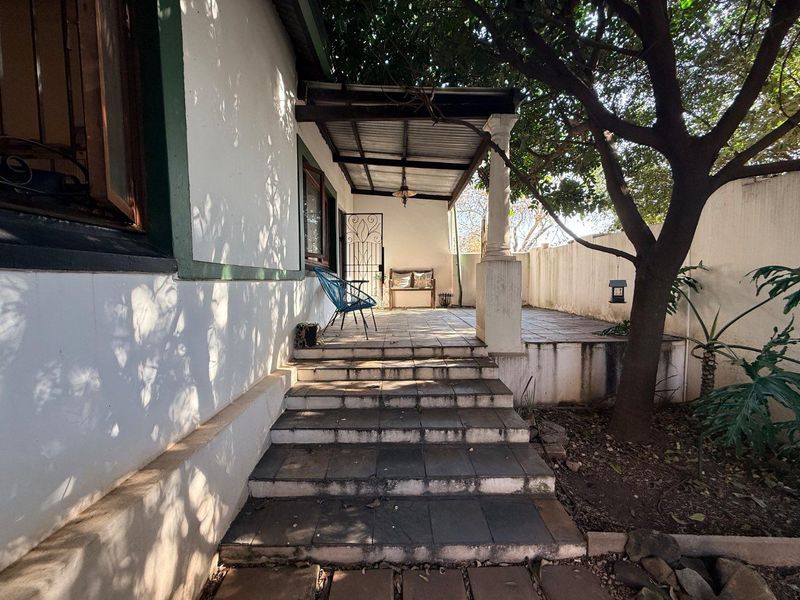 Charming 2-Bed Home with Two Bonus Units for Extra Income - Photo 2