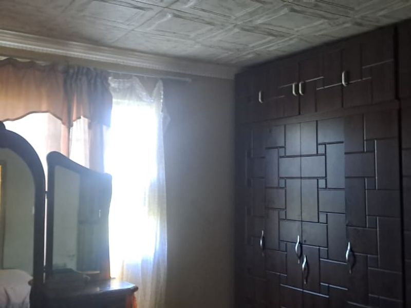 Peaceful 3-Bedroom Family Home with 2 Rondavels for Extra Income Potential - Photo 5