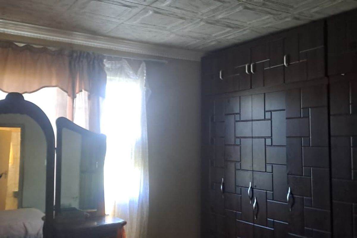 Peaceful 3-Bedroom Family Home with 2 Rondavels for Extra Income Potential - Photo 5