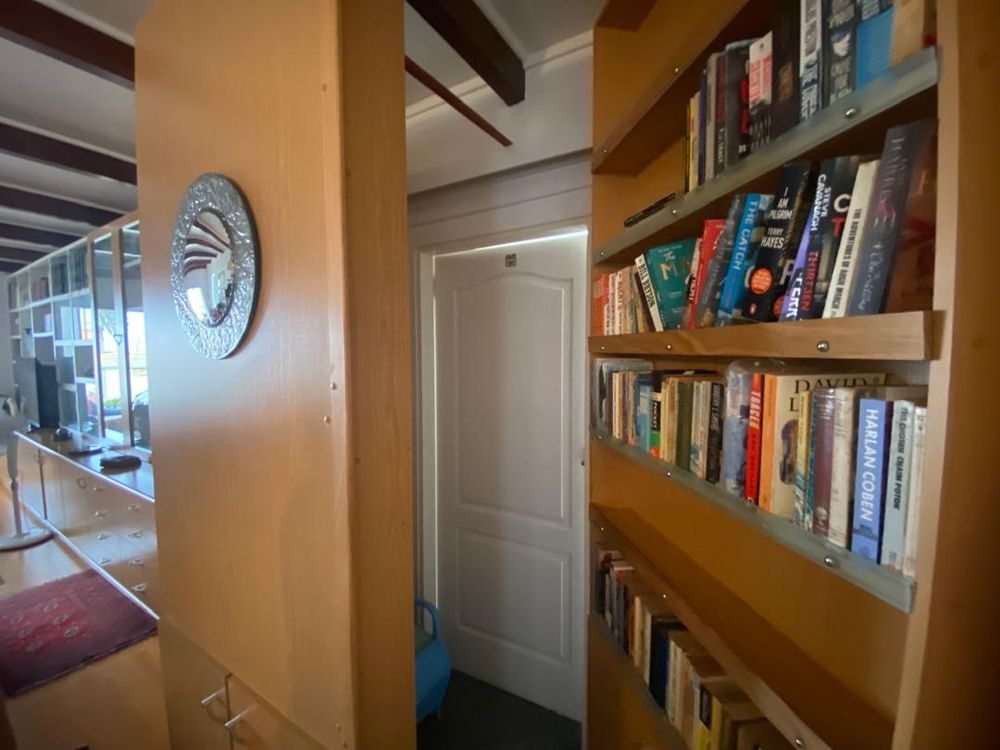 Bathroom behind the bookshelf