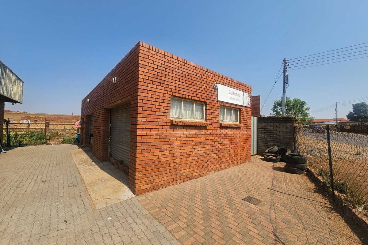 Versatile Commercial Property with Retail and Warehouse Buildings and Cold Storage - Photo 4