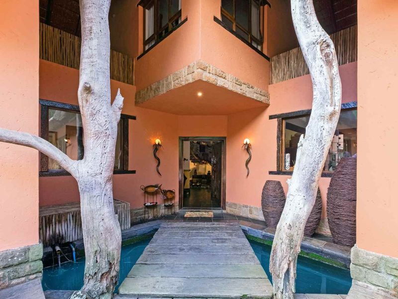 AN EXQUISITE, BUSH LODGE-THEMED, FAMILY SANCTUARY OFFERING TIMELESS ELEGANCE AND UNMATCHED TRANQUILITY IN A SERENE INDIGENOUS GARDEN SETTING - Photo 6
