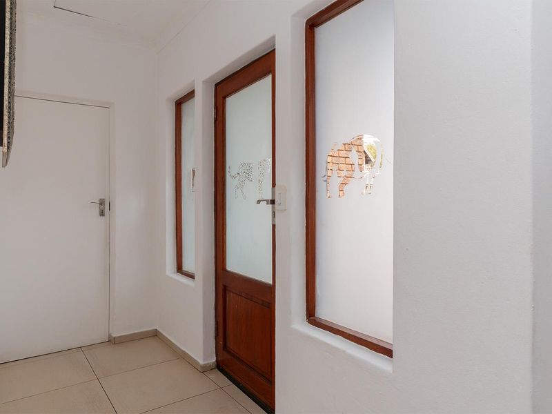 Lovely 3-bedroom facebrick home with a pool situated in a secure estate in Glen Marais - Photo 6