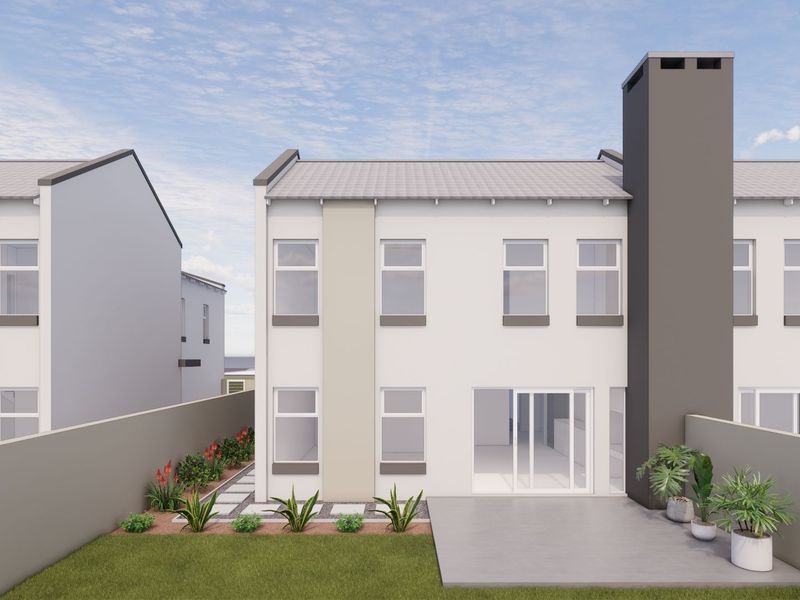 Rear view of a modern townhouse featuring a concrete patio, sliding glass doors, and a prominent chimney stack within a private garden setting.