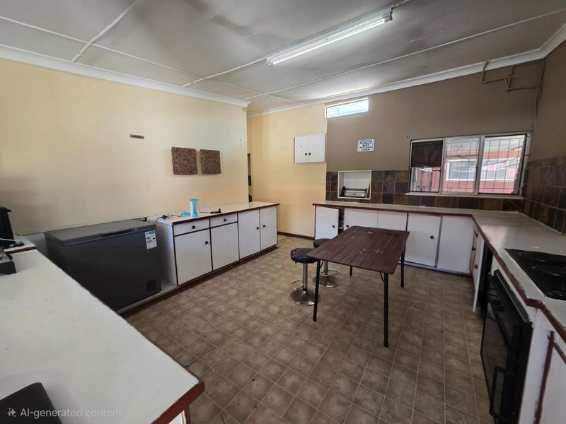 A dated kitchen featuring built-in cabinetry, tiled backsplash, and integrated cooking appliances, offering significant potential for modernization and renovation.