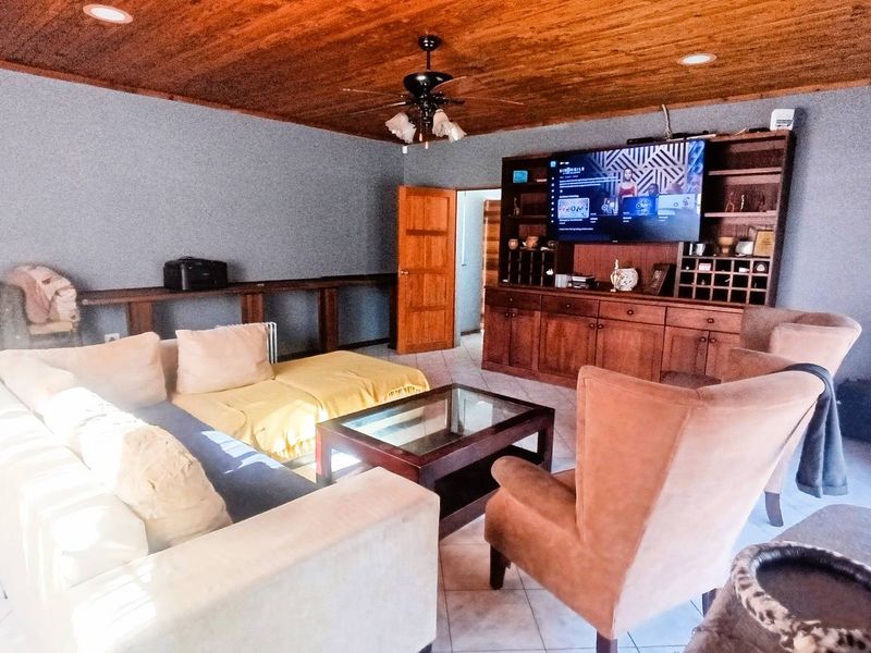 Spacious Suburban Gem:3-Bedroom Retreat with Pool and 3 Living Areas - Photo 7