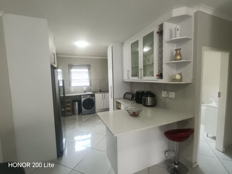 1. "Discover Your Dream Home in Mackenzie Palms!" 2. "Luxurious Living Awaits in This 3-Bedroom Gem!" 3. "Modern Comfort Meets Security in Mackenzie Palms!" 4. - Photo 7