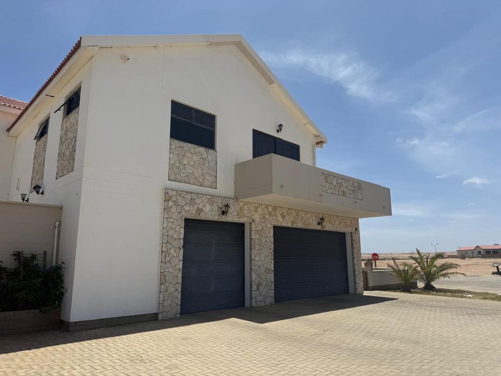 View of the house from the front with 3 garages