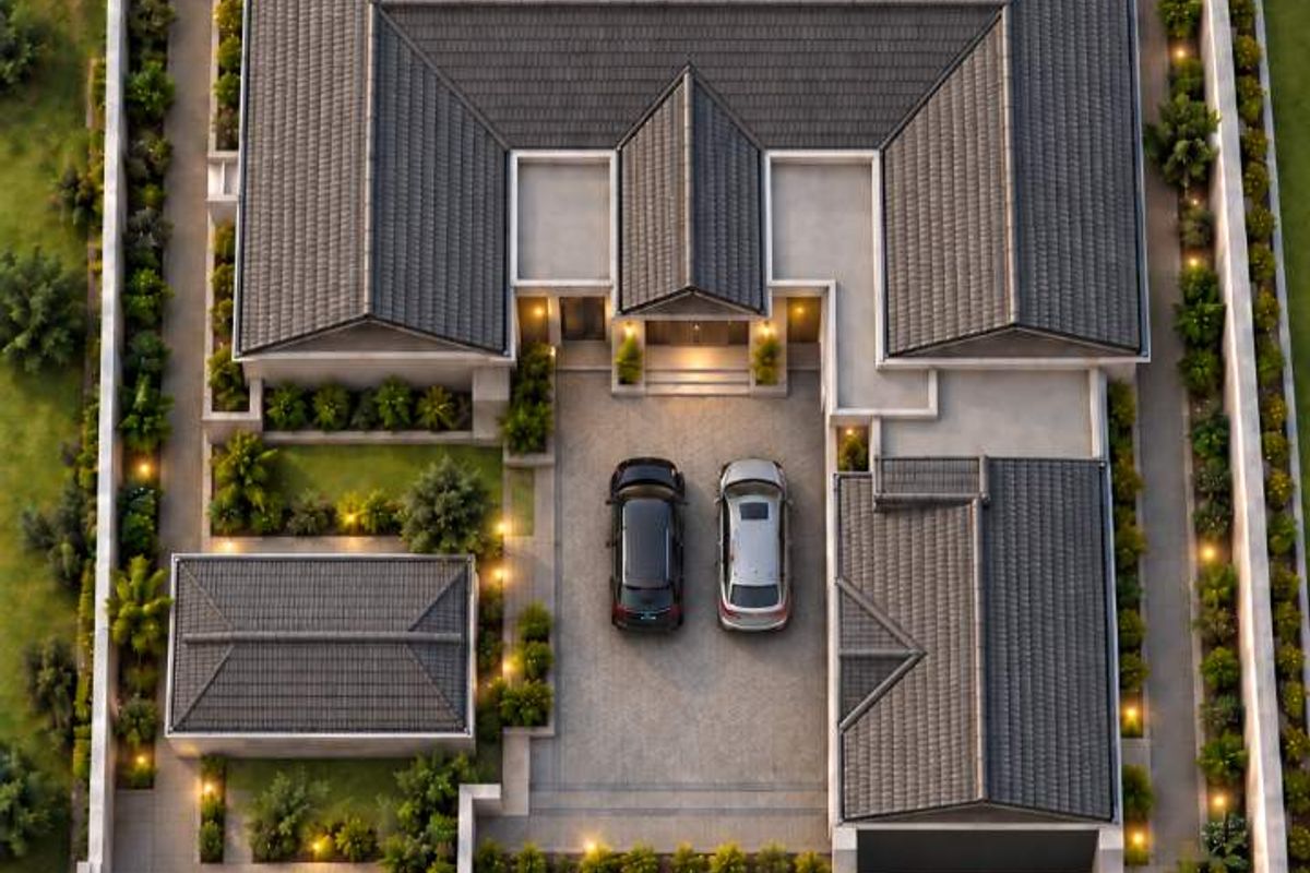 Aerial view of a residential property featuring a tiled roof, swimming pool, landscaped garden, paved driveway, and perimeter wall.