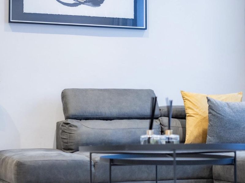 A close-up view of a living room area featuring neutral wall finishes and modern interior styling.