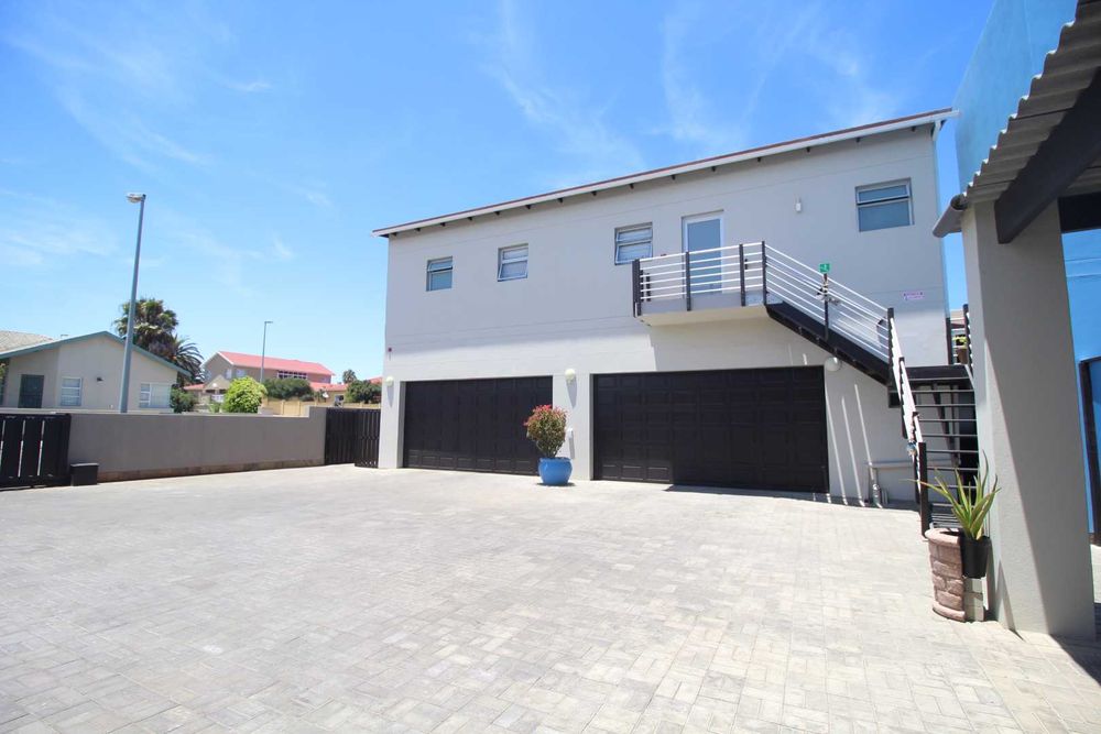 4 car garage parking, covered parking area to your right and open parking area