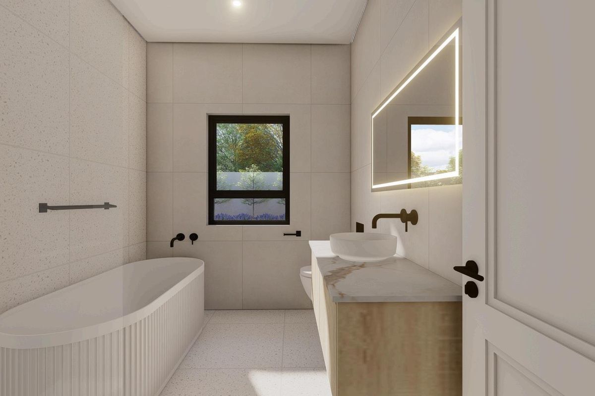 Modern bathroom featuring a freestanding fluted bathtub, wall-mounted vanity with stone countertop, vessel sink, and integrated LED mirror.