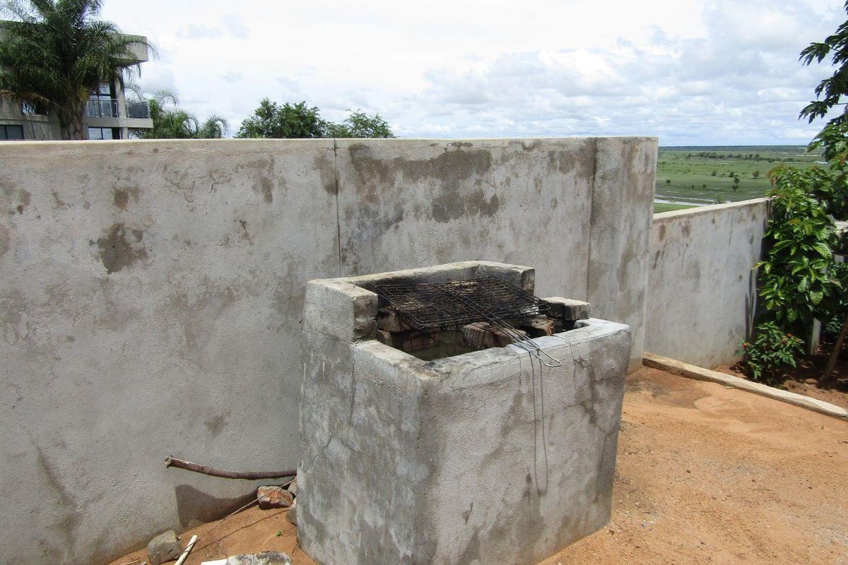 1 x 6 BEDROOM DOUBLE-STOREY HOUSE & 8 x 2 BEDROOM FLATS FOR SALE IN RUNDU: - Photo 5