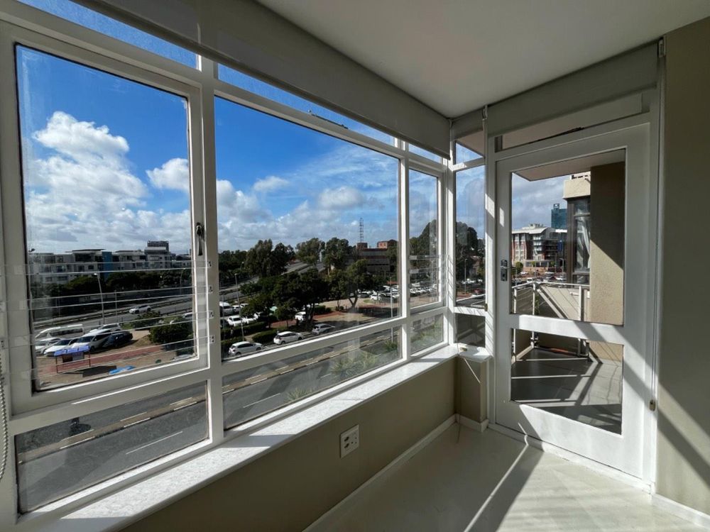 Sun Kissed Living Area and Balcony