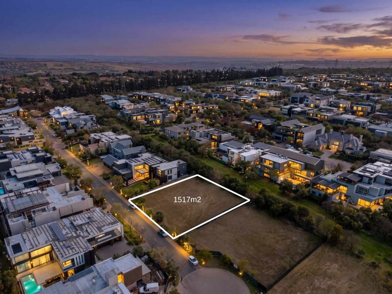 An aerial view of a 1517m2 vacant residential plot situated within a developed estate, ready for new construction.