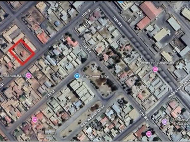 An aerial satellite view of the property location within the urban neighborhood grid, highlighting the site boundaries.