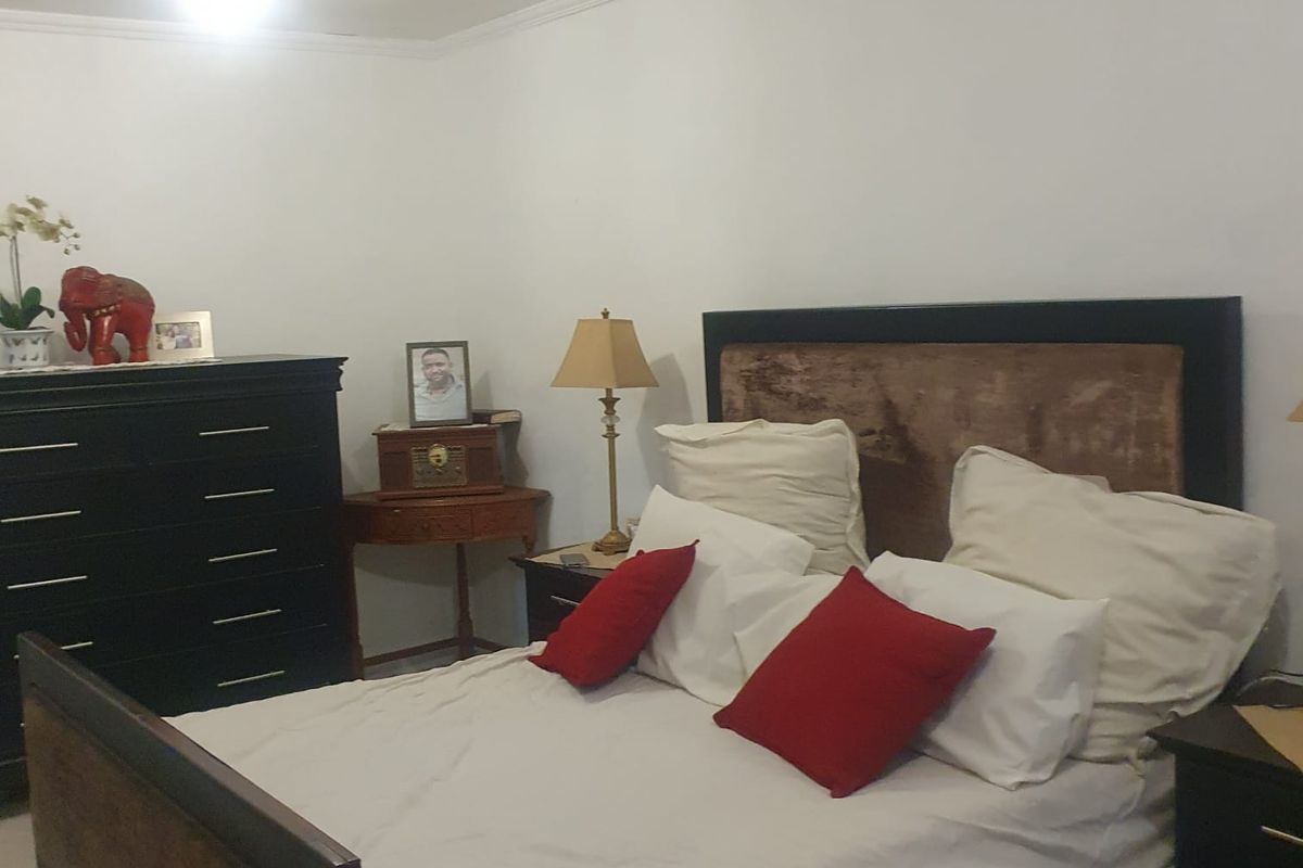 A standard bedroom featuring white walls and crown molding, providing a neutral foundation for personalization.