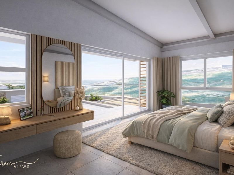 Modern bedroom featuring a built-in vanity, slatted wood wall accents, and large sliding glass doors opening to a balcony with ocean views.