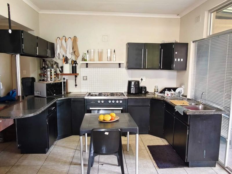 Spacious Family Home with Income-Generating Bachelors Flat on Large Stand - Photo 2