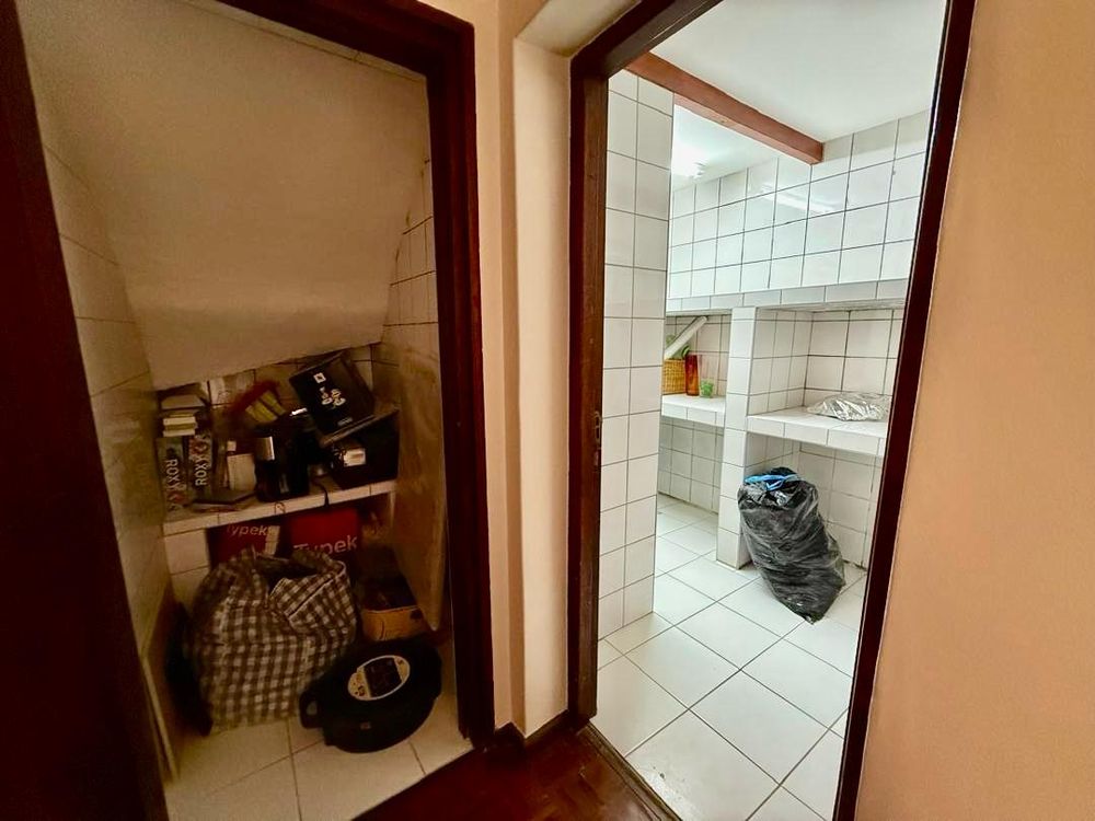 Storage under the stairs and another storage/ laundry room