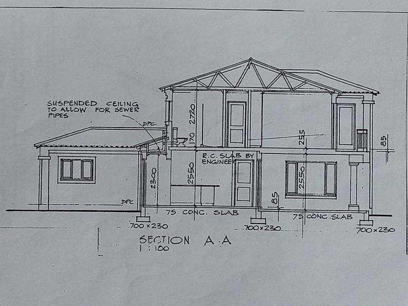 Architectural section drawing showing the structural layout, foundation details, and ceiling heights for the proposed residential building.