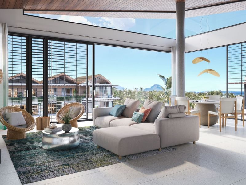 Spacious open-plan living and dining area featuring floor-to-ceiling sliding glass doors, high ceilings, and expansive views of the surrounding estate.