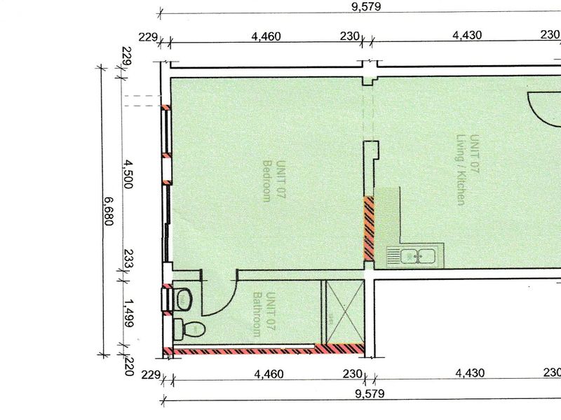 Architectural floor plan for Unit 07, showing the layout of the bedroom, living/kitchen area, and bathroom.