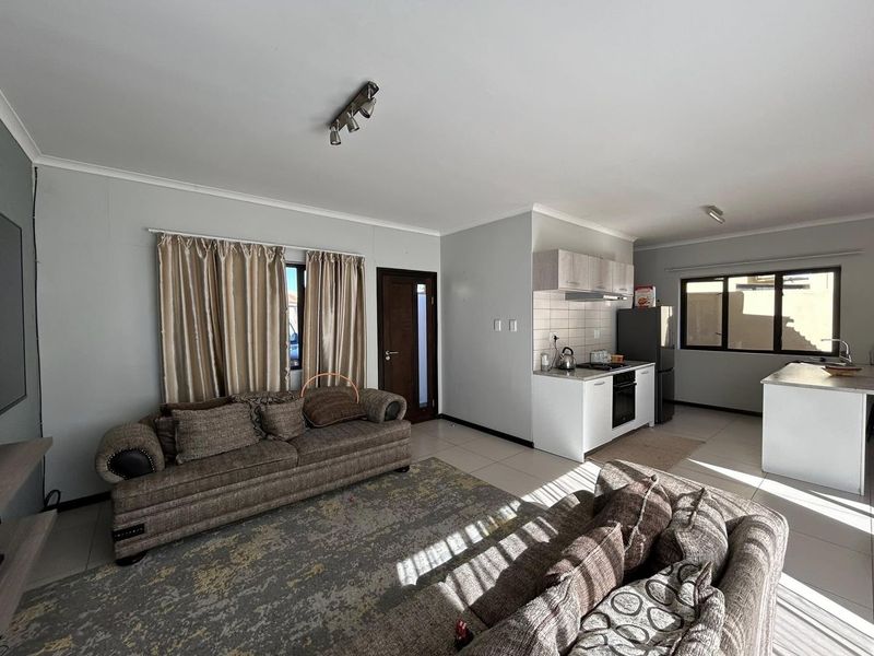 Discover this inviting 3-bedroom unit nestled in a secure gated community, offering comfort and space in a prime locatio - Photo 2