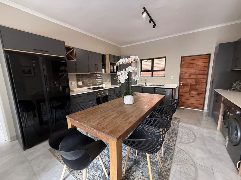 Sophisticated 3-Bedroom Simplex with Double Garage and Private Garden Sanctuary - Photo 6